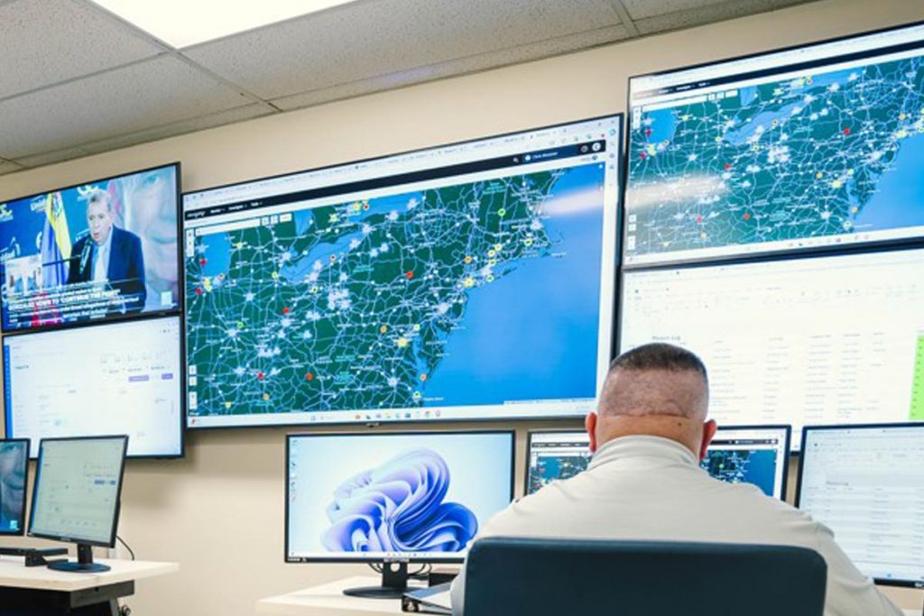 Man sitting at computer in the Security Intelligence Operations Center