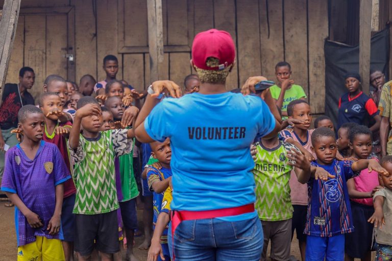 Humanitarian Aid Worker in Providing Charity to Children in Lagos Nigeria