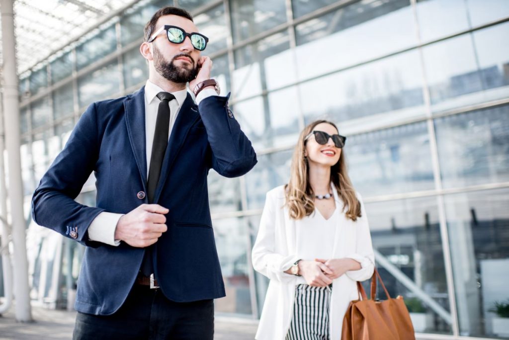 Executive Protection Agent with Female Executive at an Airport