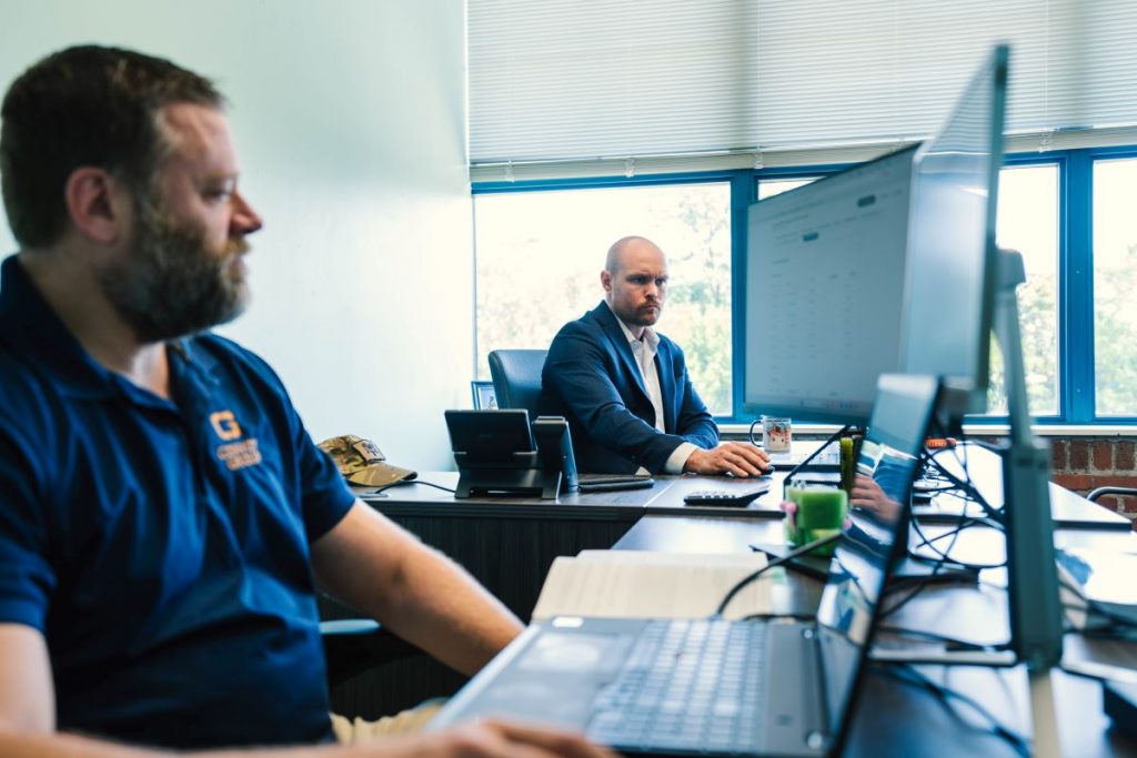 Convoy Group Expert Security Consultants Working on a Security Audit in the Convoy Group Office