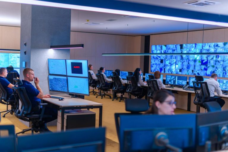 Business professional reviewing insider threat alert on desktop security dashboard